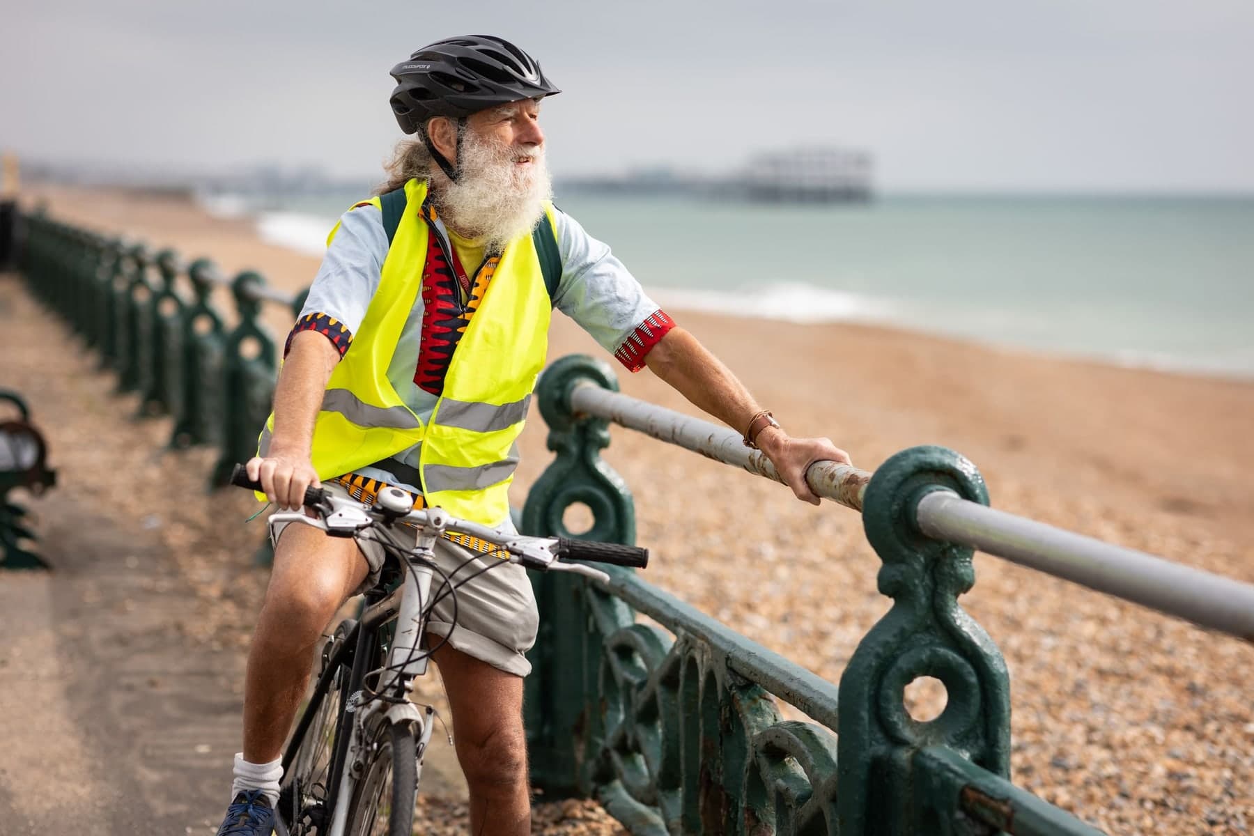 Older adult cycling with a properly fitted helmet