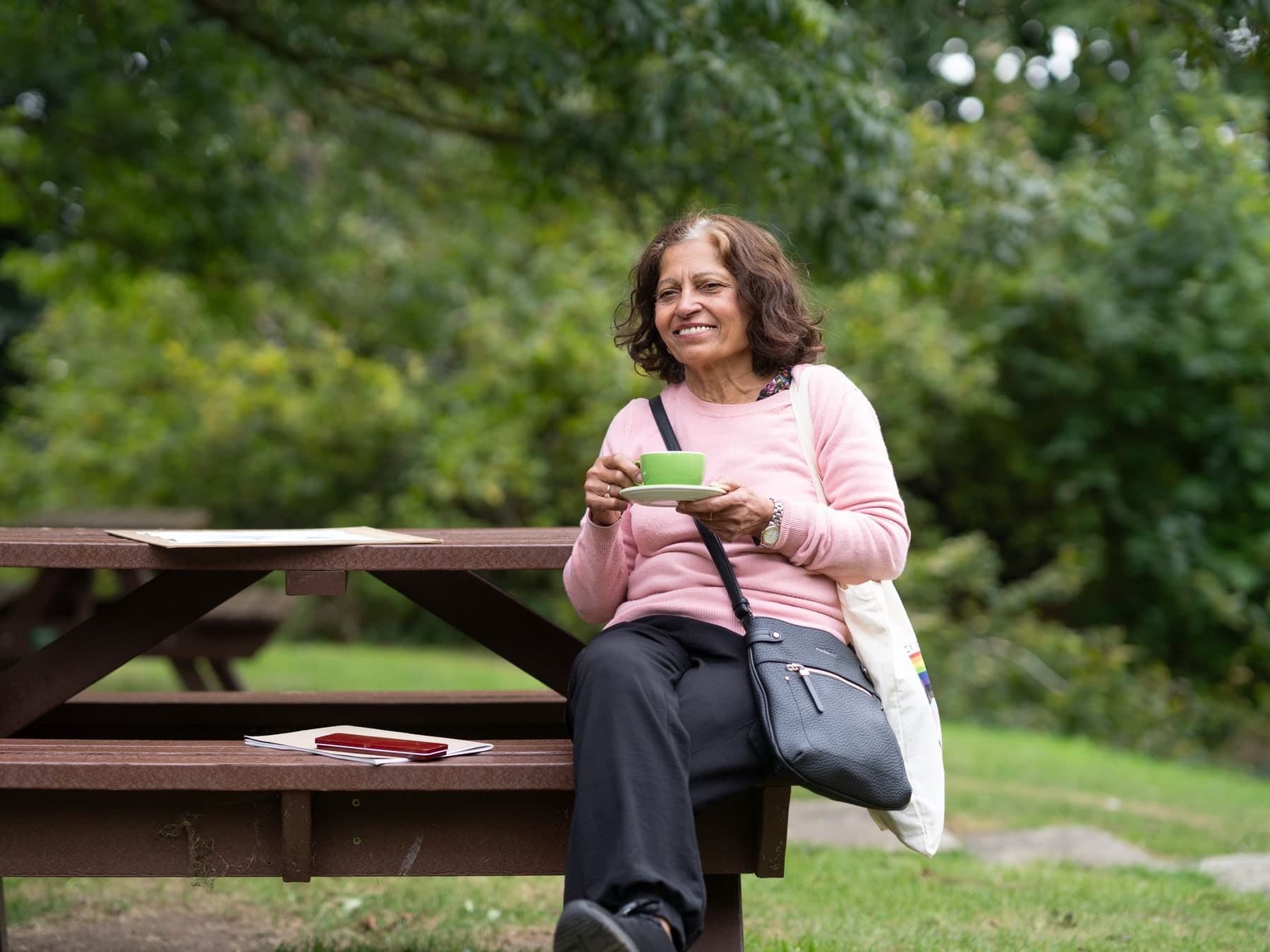 Older woman relaxing in a sunny garden