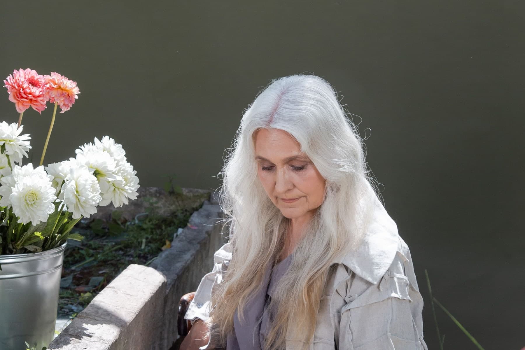 Mature woman relaxing outdoors in a peaceful garden