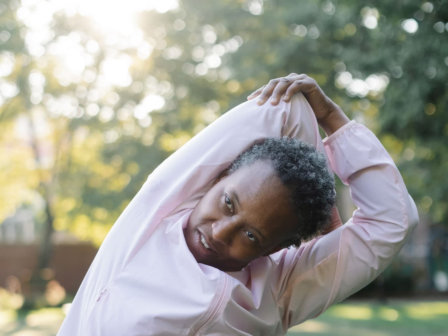 Older adult performing resistance training with dumbbells