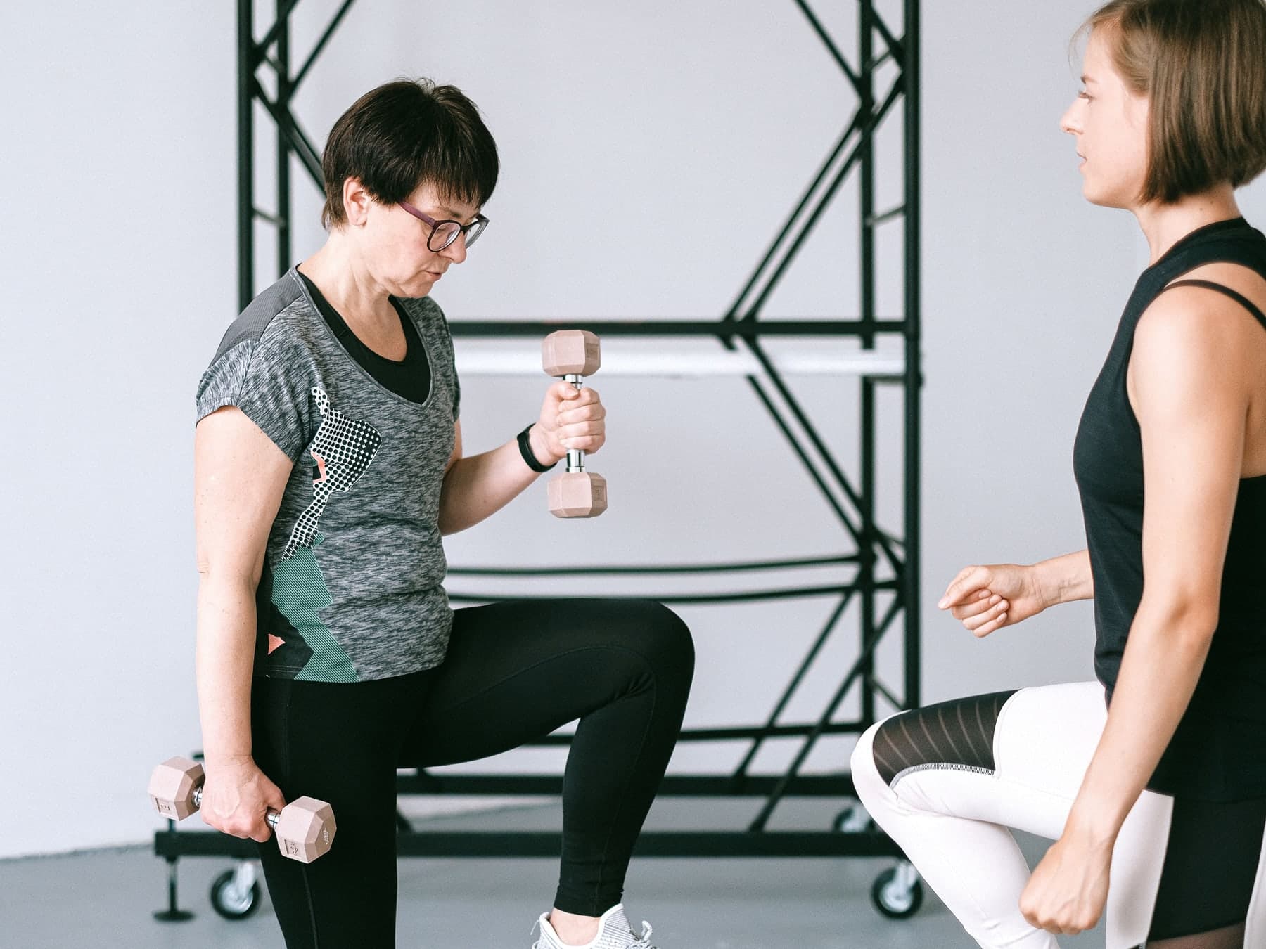 Woman in her 60s performing a controlled strength exercise
